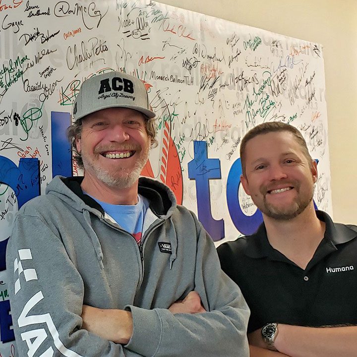 Greg Tish and Justin Colvin behind the mic doing a the Medicare Podcast