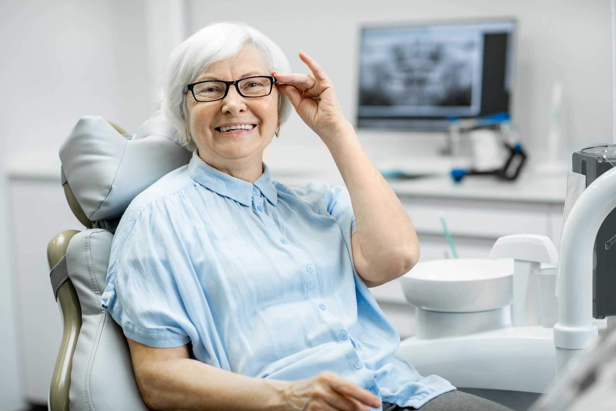 Portrait of a senior woman at the dental office going over her Medicare Supplements and Dental Coverage